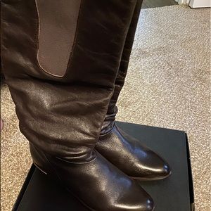 Black knee high length leather boots